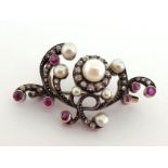 A 19th century pearl (untested), diamond and ruby brooch, the openwork scroll mount pave set overall