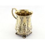 A Victorian silver christening mug by John Evans (II), London, 1852, lobed sides embossed with