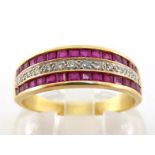 A ruby and diamond half hoop ring, composed of two rows of calibre cut rubies, a line of single cuts