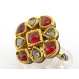 An Indian diamond, ruby and enamel ring, the square cluster composed of alternate table cut diamonds