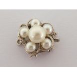 A cultured pearl cluster clasp, stamped '14k' (partially obscured) verso, 3gms