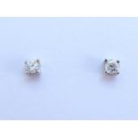 A pair of 18 carat white gold and single stone diamond ear studs, each brilliant approx. 0.12 carat,