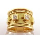 An 18 carat gold and diamond Templar ring by Elizabeth Gage, with eight collet set princess cut