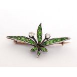 An early 20th century demantoid garnet and diamond spray brooch, set overall with graduated round