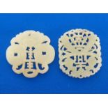 Two Chinese white jade openwork plaques, one circular plaque finely carved and pierced with a bat,
