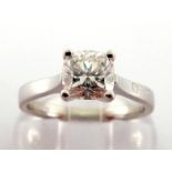 An 18 carat white gold and single stone diamond ring, the cushion shaped brilliant cut approx. 0.9