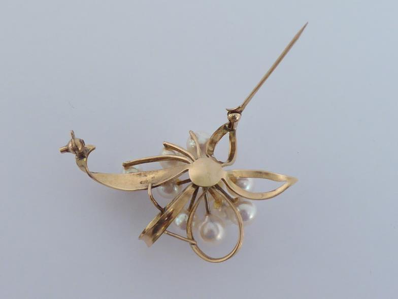 A cultured pearl spray brooch, the cluster of ten 5-7mm pearls above a open work flower mount, - Image 4 of 4