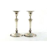 A pair of Edwardian silver dwarf candlesticks by Turner Bradbury, London, 1901, fluted tapering