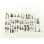 A mixed lot comprising twenty four pairs of white metal / silver earrings