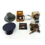 World War II items:- An RAF cap, a Supplementary Fire Party civilian helmet, a gas mask in