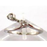 A 14 carat gold and two stone diamond ring, the two brilliants totalling approx..0.3carat, the shank