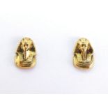 A pair of Egyptian gold ear studs, modelled as the head of a Pharaoh, tests 14 carat gold, butterfly