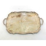 A silver two-handled tray of shaped rectangular outline with moulded border, by Walker & Hall,