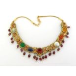 An Indian multi-gem and enamel necklace, set along its length with ruby, sapphire, foil backed