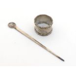 A silver napkin ring (marks rubbed) and a German silver letter opener, 65 gms.