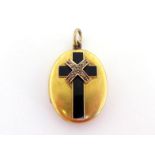 A Victorian gold, diamond and enamel mourning locket, the black enamel cross with rose cut detail,