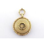 A gold watchcase vinaigrette, unmarked, English, circa 1825, engine-turned, with floral borders,