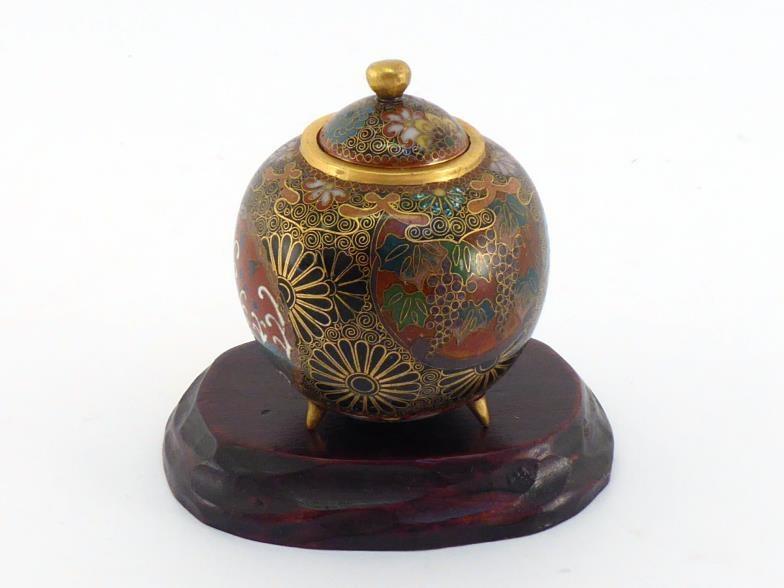 A small Japanese Ando cloisonné enamel jar in ovoid form with lid and tripod, very detailed