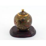 A small Japanese Ando cloisonné enamel jar in ovoid form with lid and tripod, very detailed