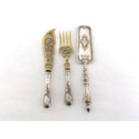 A pair of German silver-handled fish servers with gilt metal blade and tines, circa 1900, handles