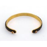 A gold, ruby and bronze bangle, possibly by Nada Le Cavelier, the outer textured bronze band with