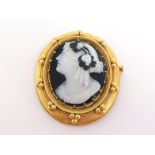 A 19th century layered sardonyx cameo by Eugene Fontenay, the oval cameo depicting a classical