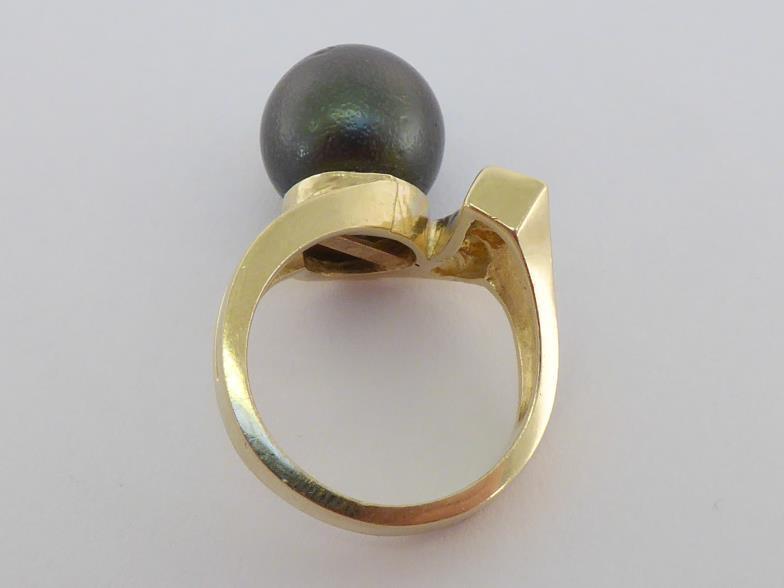 A Tahitian cultured pearl and diamond ring, the large pearl 12.3mm diameter, obliquely set, the tail - Image 2 of 4