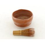 A Japanese Shino ware tea bowl and tea dust brush, tea bowl decorated with wavy crackled glaze in