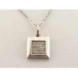 A diamond pendant, the square pendant pave set to the centre with a panel of small brilliants, the