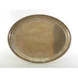 An Italian oval silver tray, .800 standard, by Rino Greggio, Padua, pre-1968, with gadroon rim, 37.6