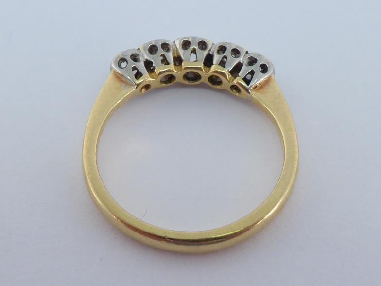 An 18 carat gold and five stone diamond ring, set with five graduated old brilliants totalling - Image 2 of 3