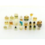 Twenty three miniature bottles of perfume and eau de toilette, most complete with contents,,