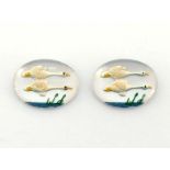 A pair of reverse intaglios, the glass ovals painted with flying swans, 2cm long
