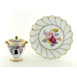 A large cake plate, the centre hand-painted with a floral display, the border petals with