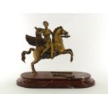 A gilt metal figure of Athena holding a branch of olive or myrtle astride Pegasus rearing on his