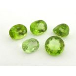 A group of five loose faceted peridot, totalling approx. 13.93 carats. (note: VAT will be added to