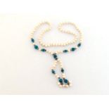 A cultured pearl and turquoise bead necklace, composed of uniform off round circled pearls,