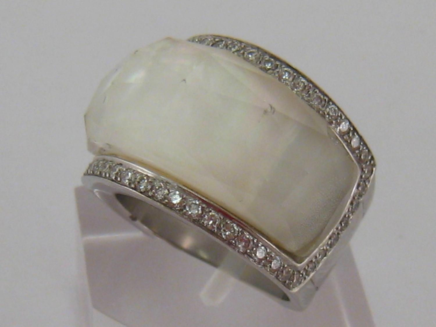 A diamond and mother of pearl dress ring, the large facetted crystal bezel overlaying the mother- - Image 2 of 2