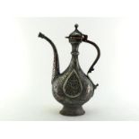 An Islamic copper and white metal coffee pot of traditional form and decoration, probably Egyptian