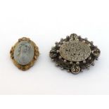 Two 19th century brooches, including a late Victorian silerv machine made brooch, of oval design,