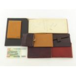 Seven leather items, being wallets, folders and a purse, together with an autograph album