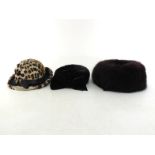 Three Ladies fur hats, all as new comprising of one leopard print, one with velvet bow and one