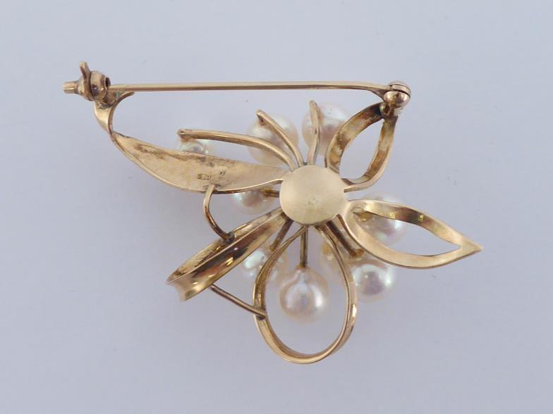 A cultured pearl spray brooch, the cluster of ten 5-7mm pearls above a open work flower mount, - Image 2 of 4