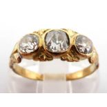 A Victorian three stone diamond ring, the graduated cushion cut stones 3.8, 4.5 and 3.8mm, within an