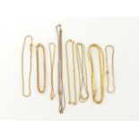 A mixed lot comprising eight gold and yellow metal chains / bracelets, gross weight 21 gms