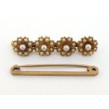 A seed pearl bar brooch, composed of four seed pearl set flower heads, mounted in yellow metal, (