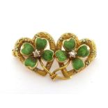 A diamond and enamel double-heart and clover brooch, the two open work hearts with chased and
