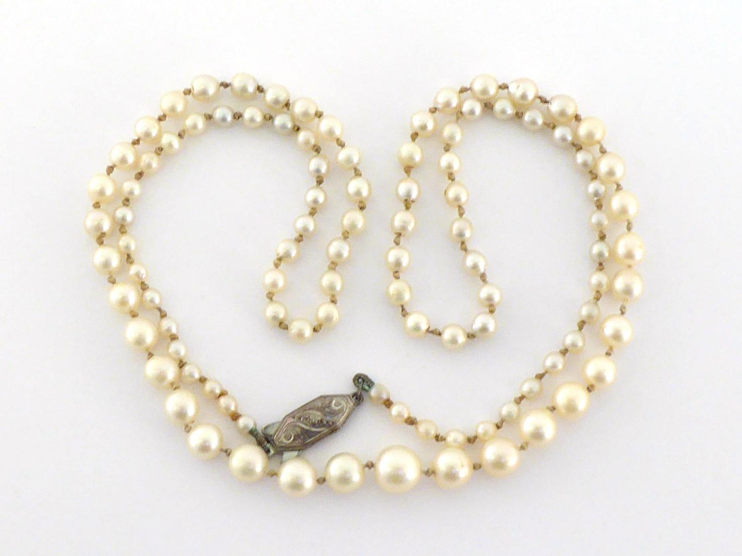 A graduated cultured pearl necklace, 56cm long, largest pearl approx. 7.1mm
