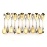 A set of 12 German parcel-gilt silver sorbet spoons, circa 1900, chased with iris, 14.2 cm. long,
