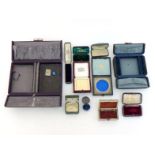 A collection of vintage jewellery boxes, including 'Mappin & Webb (brooch), 'Hunt & Roskell' (ring),